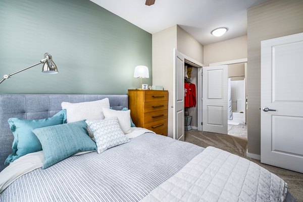 Elegant bedroom with modern decor at Whetstone Apartments