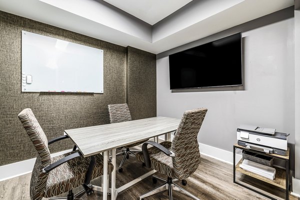 Clubhouse meeting facility with modern decor at Whetstone Apartments, a Greystar luxury community