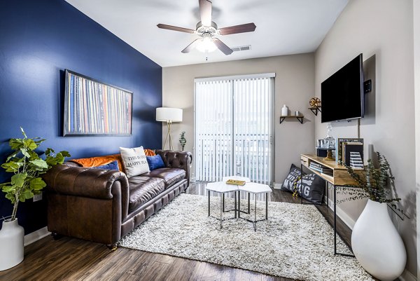 Modern living room with sleek furniture and stunning views at Whetstone Apartments