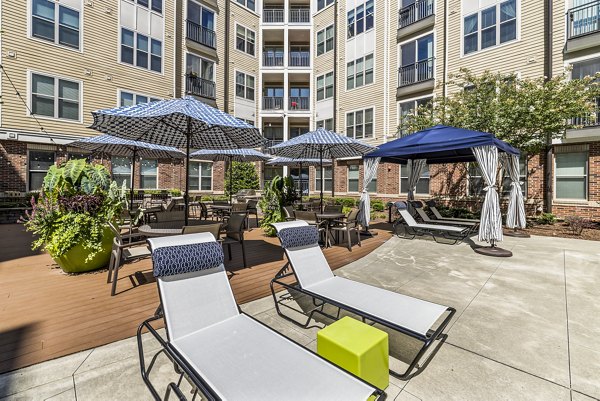 Pool patio with comfy seating at Whetstone Apartments, showcasing luxury living at Greystar's finest community in the heart of the city
