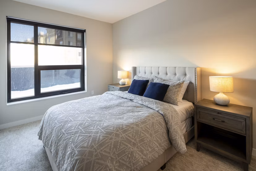 Cozy bedroom with elegant furnishings at The Berkman Apartments
