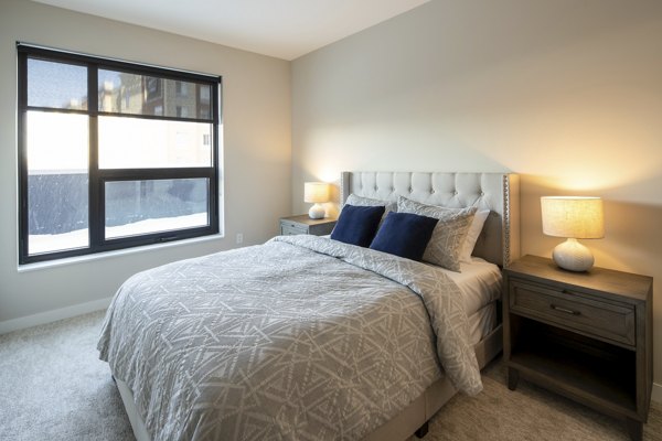 Cozy bedroom with elegant furnishings at The Berkman Apartments