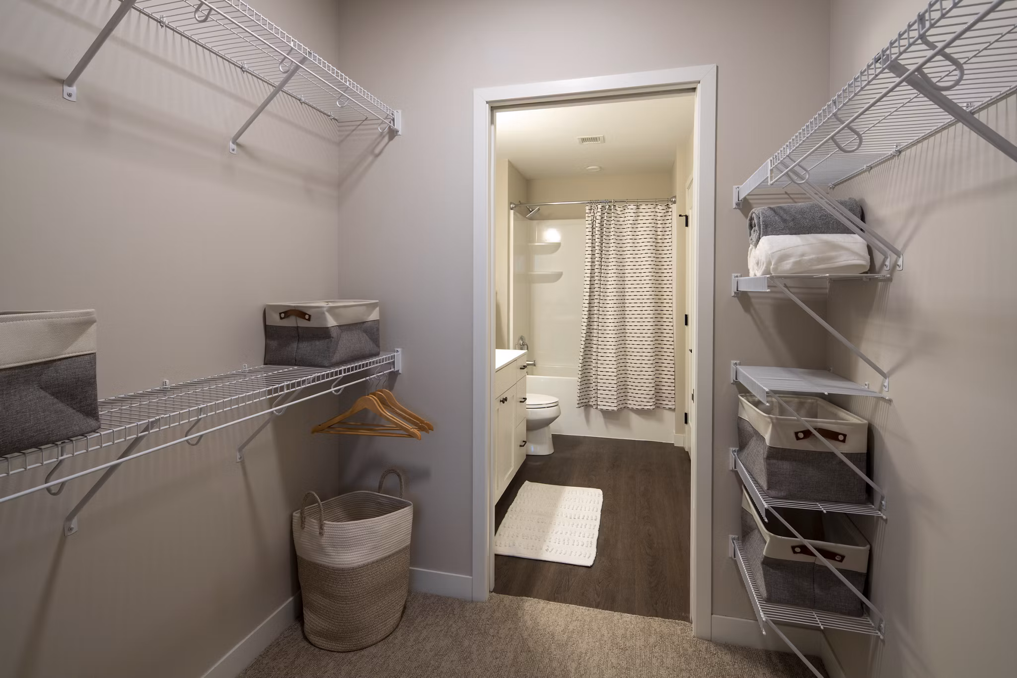 Luxurious bathroom with marble countertops and spacious tub at The Berkman Apartments