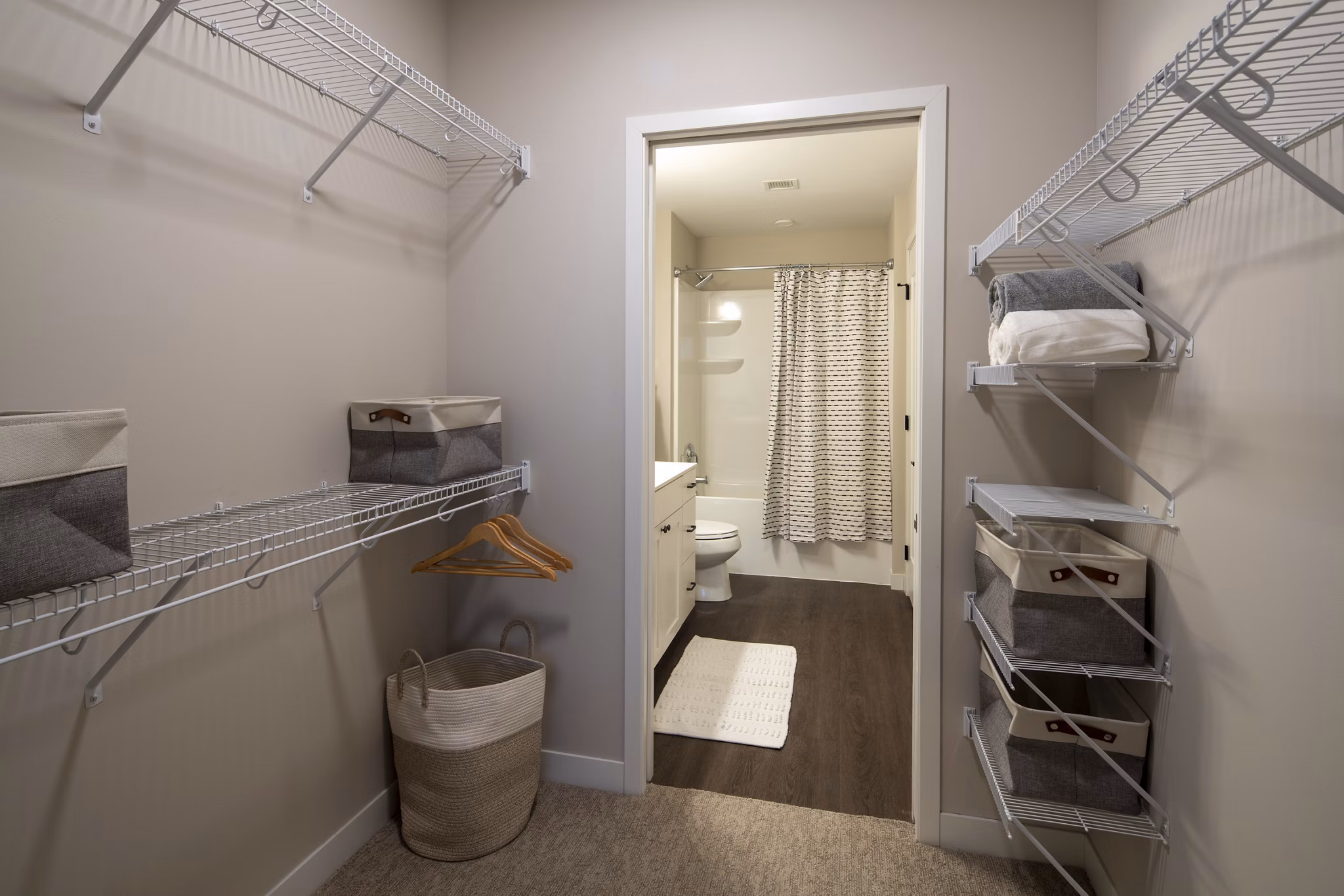 Luxurious bathroom with marble countertops and spacious tub at The Berkman Apartments