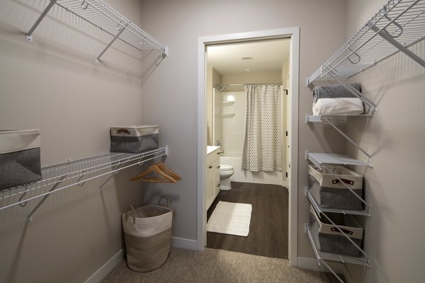 Luxurious bathroom with marble countertops and spacious tub at The Berkman Apartments