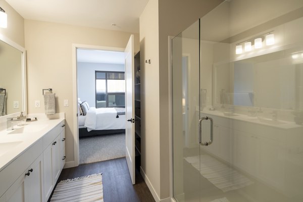 Luxurious bathroom featuring marble countertops and modern fixtures at The Berkman Apartments