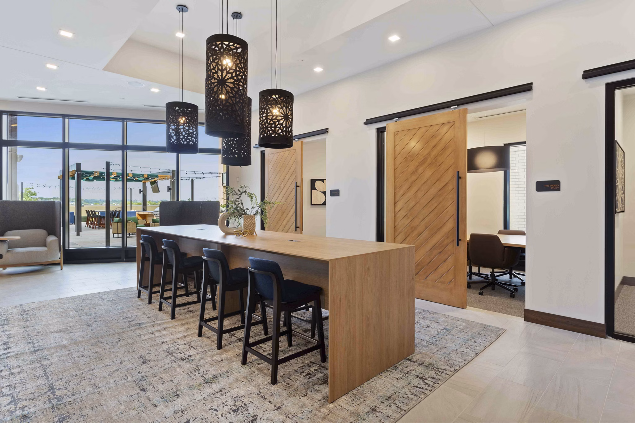 Stylish clubhouse with modern seating and decor at The Berkman Apartments