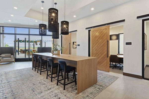 Stylish clubhouse with modern seating and decor at The Berkman Apartments