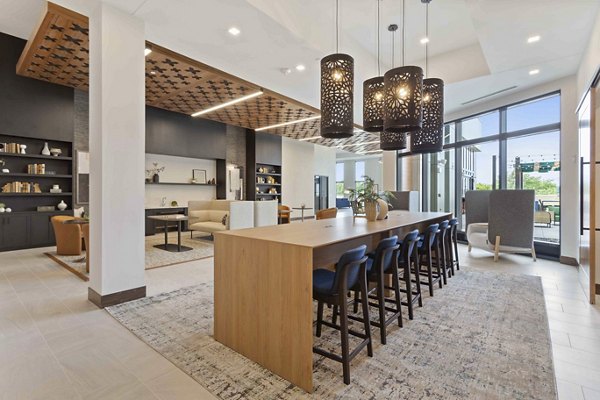 Modern clubhouse featuring elegant seating areas at The Berkman Apartments, perfect for socializing and events in a luxurious setting