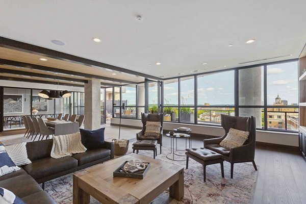 Clubhouse with luxurious seating and communal spaces at The Berkman Apartments