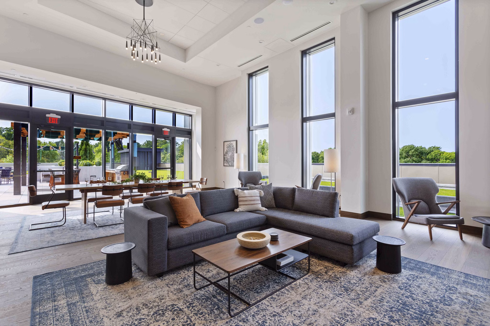 Clubhouse featuring modern design and lounge areas at The Berkman Apartments