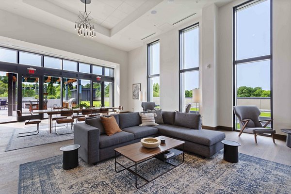 Clubhouse featuring modern design and lounge areas at The Berkman Apartments