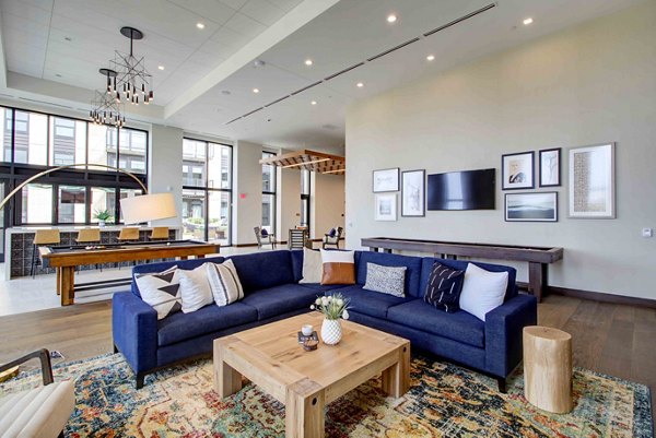 Clubhouse with modern design and comfortable seating at The Berkman Apartments, offering luxury amenities and social spaces for residents