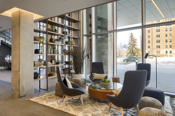 Elegant clubhouse featuring modern decor at The Berkman Apartments, perfect for social gatherings and community events
