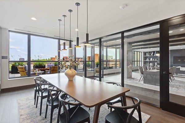 Modern meeting facility with ample seating at The Berkman Apartments in Rochester, ideal for hosting professional events