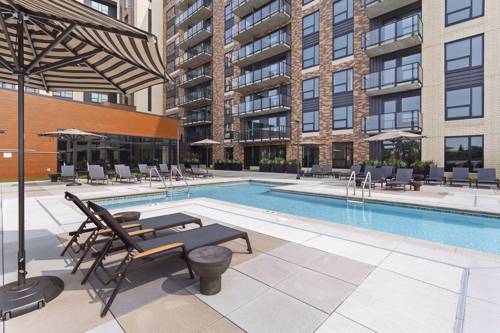 Rooftop pool with city skyline views at The Berkman Apartments