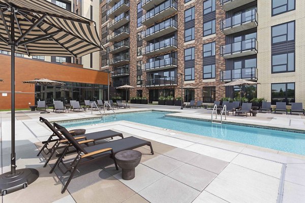 Rooftop pool with city skyline views at The Berkman Apartments
