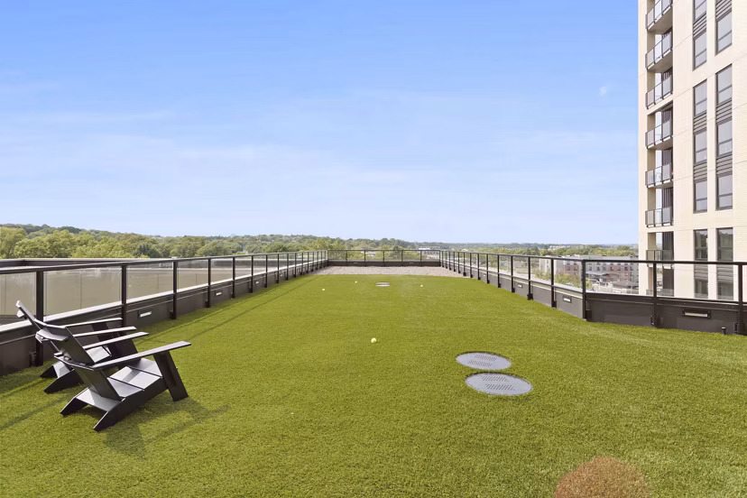 Outdoor sport court with basketball hoops at The Berkman Apartments; perfect for active residents