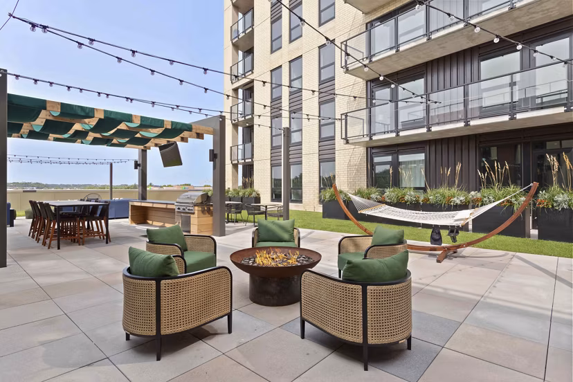 Cozy outdoor fire pit seating area at The Berkman Apartments