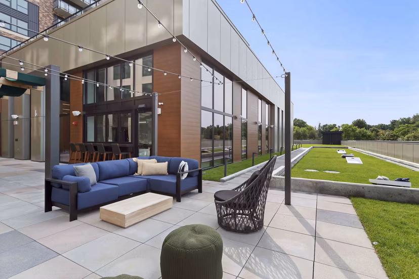 The Berkman Apartments: Stylish courtyard featuring modern seating and lush greenery near Greystar luxury apartments in vibrant neighborhood