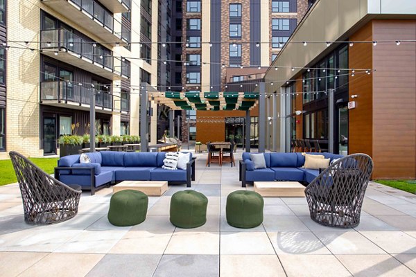 Courtyard with seating and garden at The Berkman Apartments, a luxury community