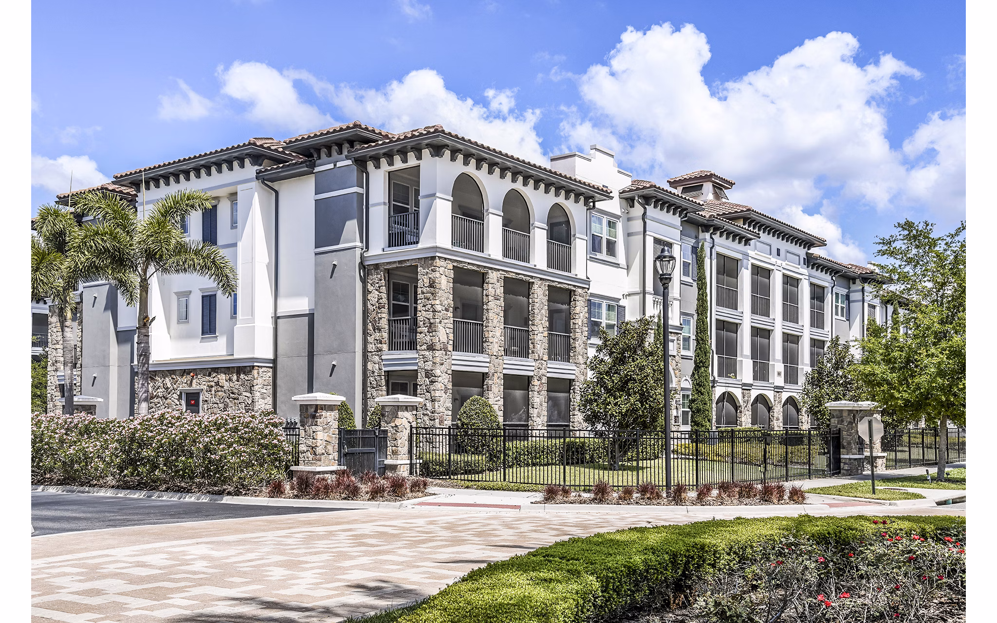 Venetian Isle Apartments: Elegant waterfront building with lush landscaping in Miami