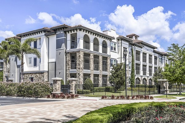 Venetian Isle Apartments: Elegant waterfront building with lush landscaping in Miami