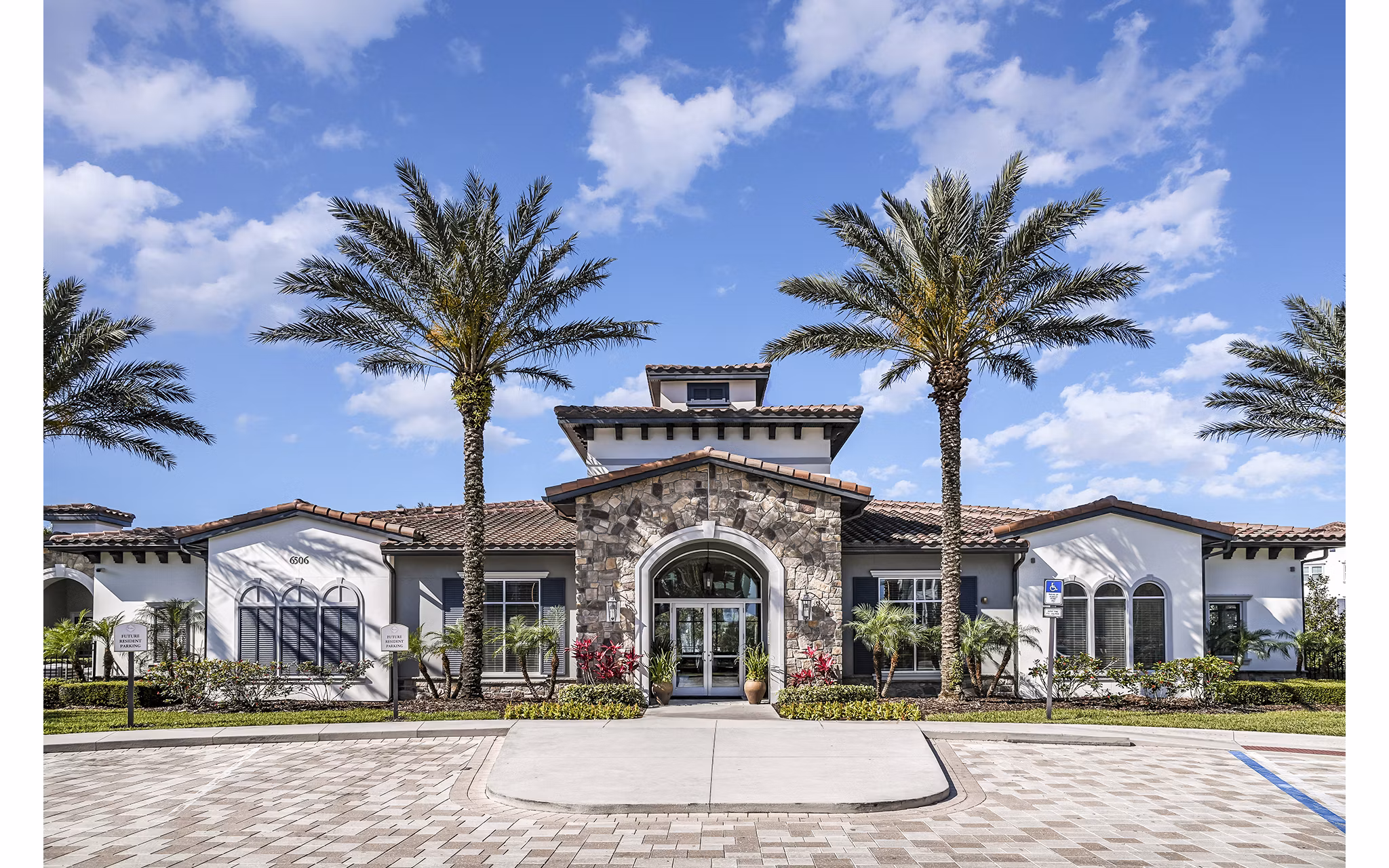 Elegant clubhouse and leasing office at Venetian Isle Apartments featuring modern architecture and stylish decor