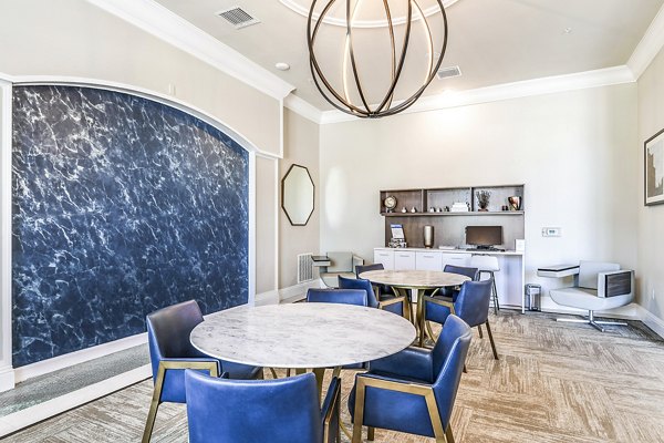 Clubhouse business center with modern workstations at Venetian Isle Apartments, ideal for remote work and meetings