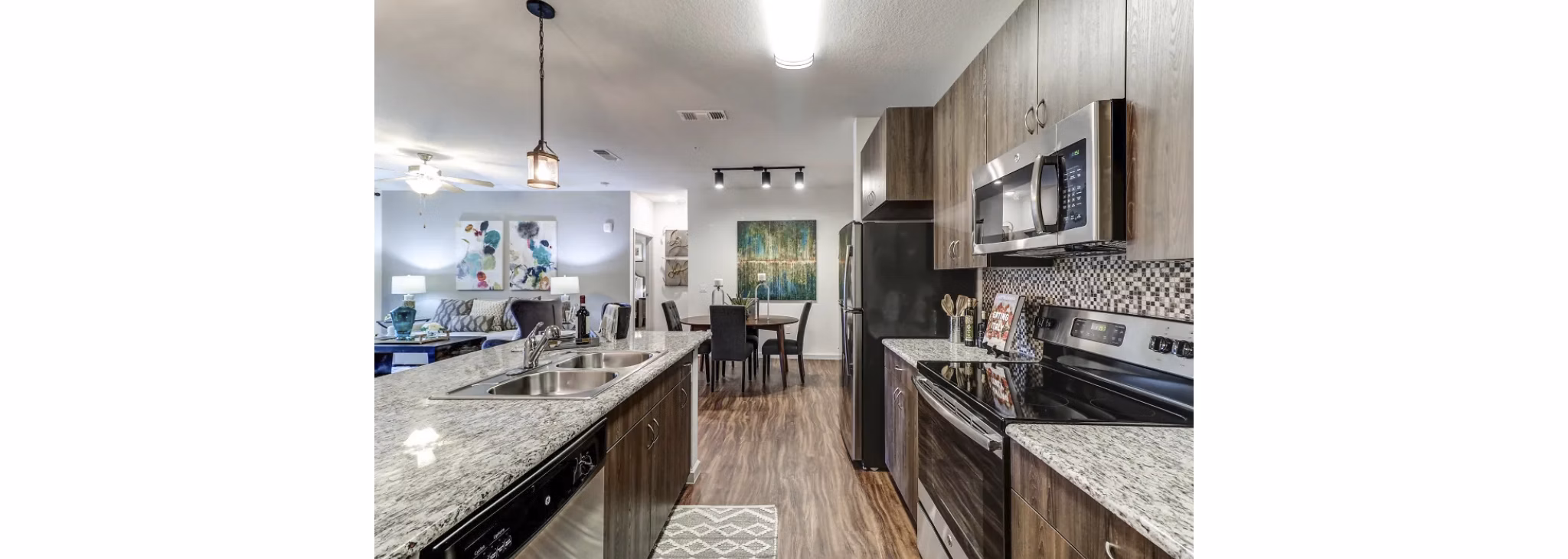 Modern kitchen with stainless steel appliances at Venetian Isle Apartments