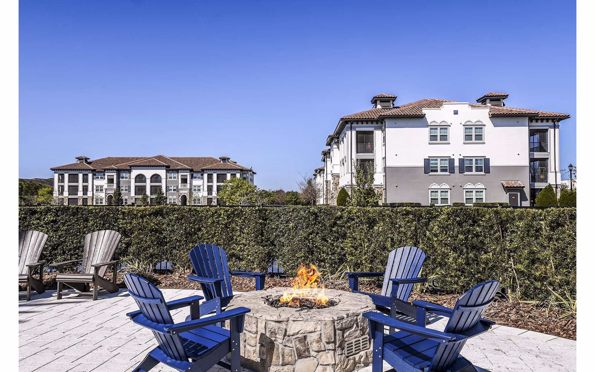 Cozy fire pit on the patio at Venetian Isle Apartments, perfect for outdoor relaxation