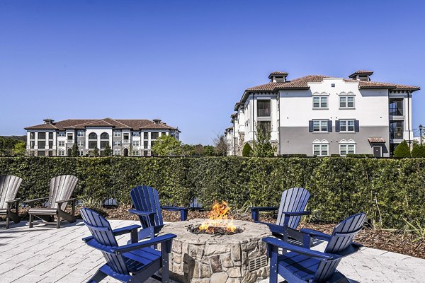 Cozy fire pit on the patio at Venetian Isle Apartments, perfect for outdoor relaxation