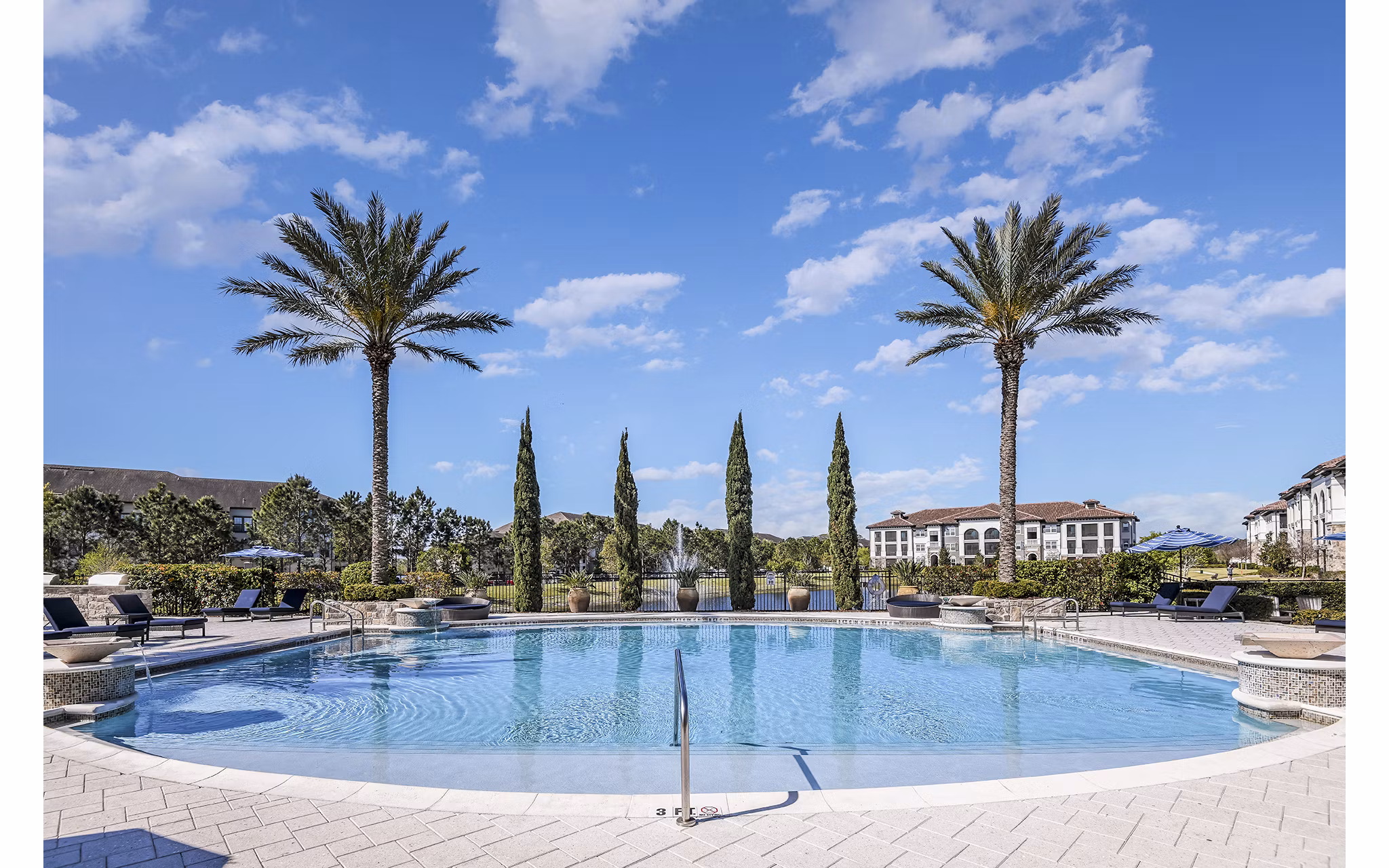 Luxury pool with cabanas at Venetian Isle Apartments, featuring resort-style amenities for relaxation and entertainment