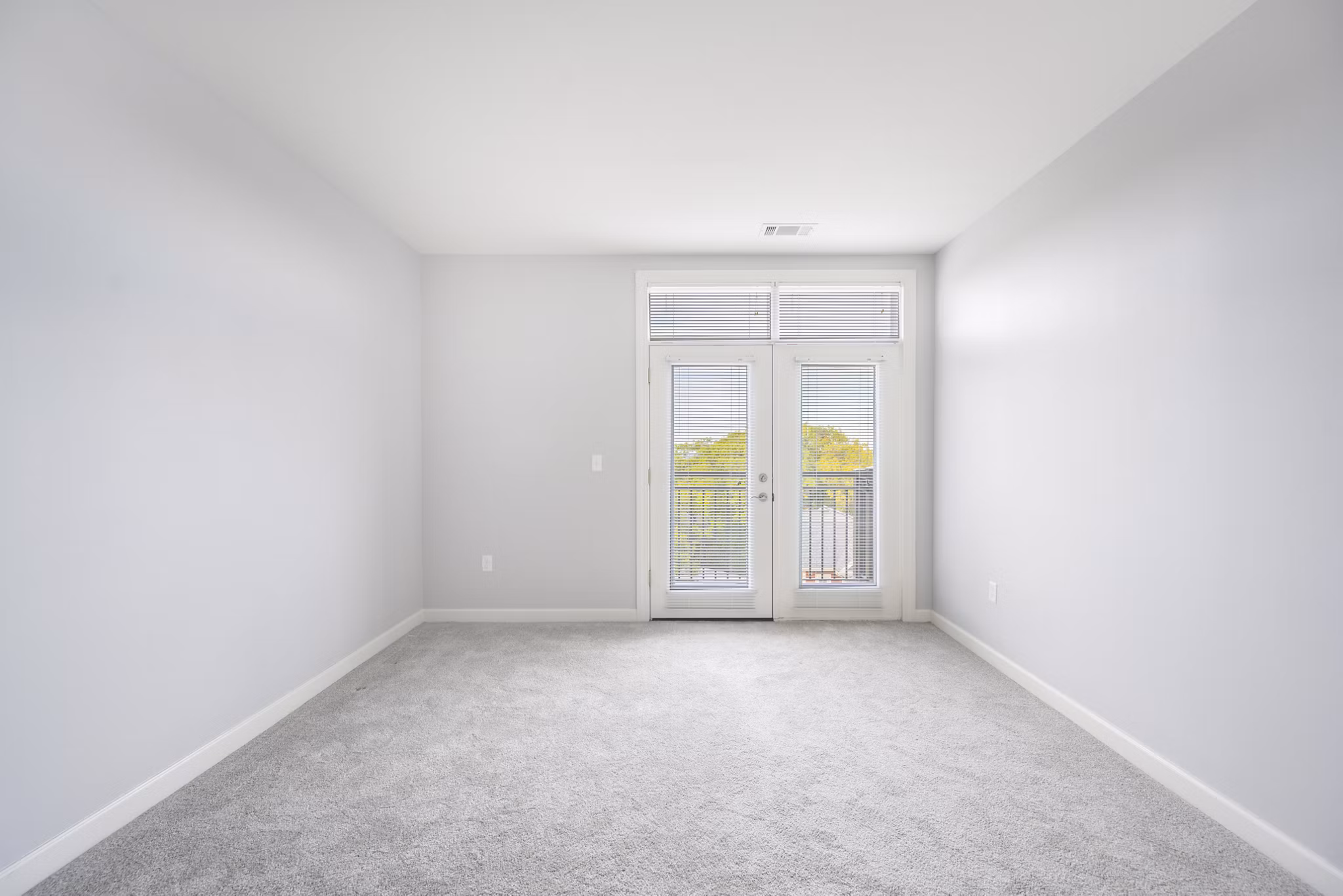 Bedroom featuring modern decor and ample natural light at Arlington 360 Apartments