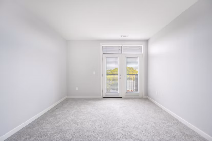Bedroom featuring modern decor and ample natural light at Arlington 360 Apartments