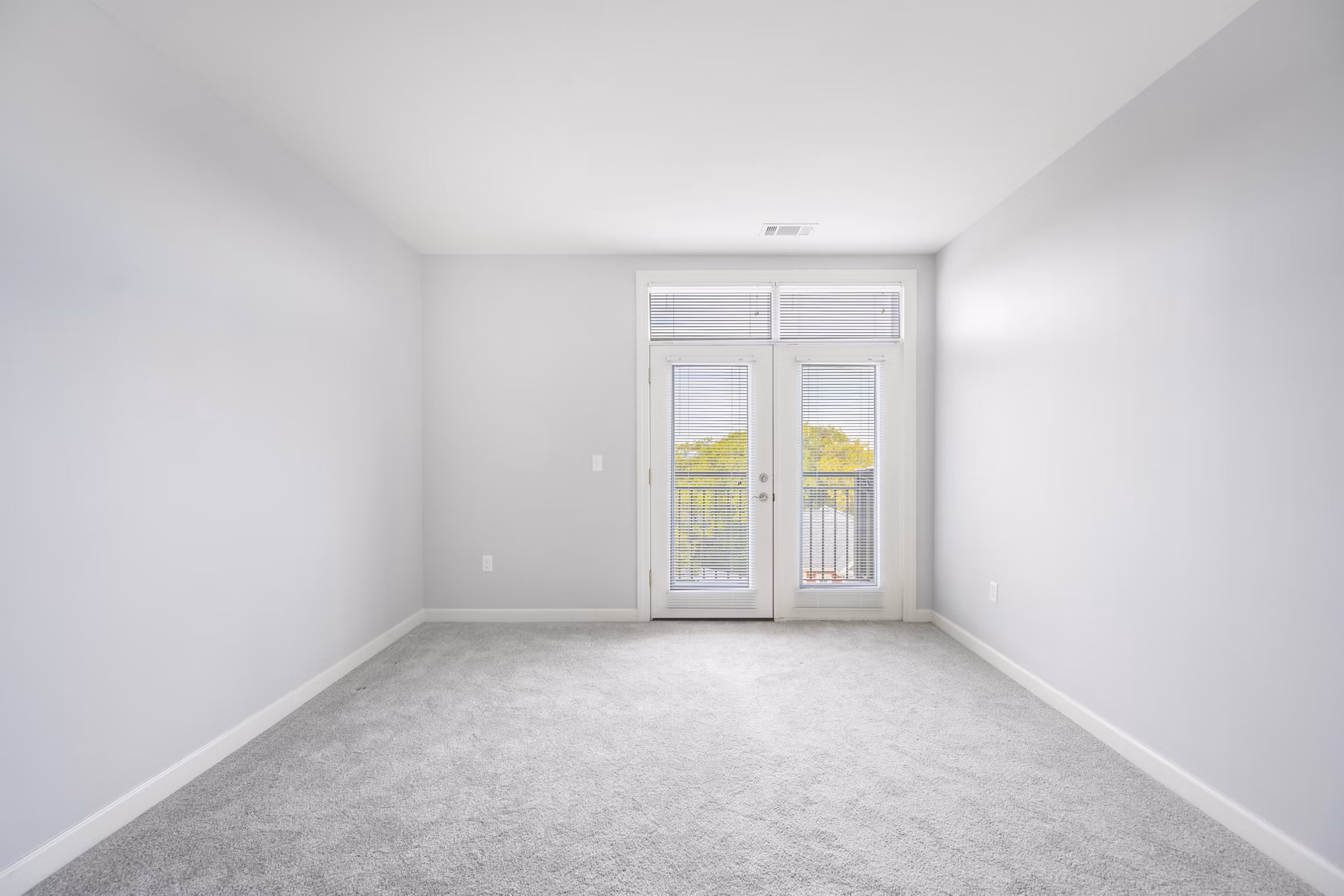 Bedroom featuring modern decor and ample natural light at Arlington 360 Apartments
