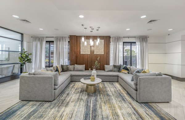 Clubhouse with modern design and leisure spaces at Arlington 360 Apartments in Arlington, MA