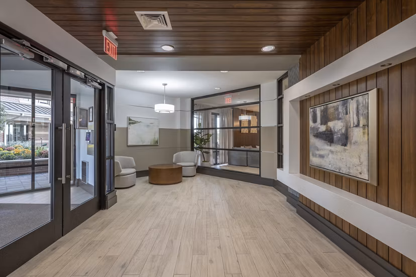 Elegant clubhouse featuring lounge seating and games at Arlington 360 Apartments, offering luxury living in a scenic location