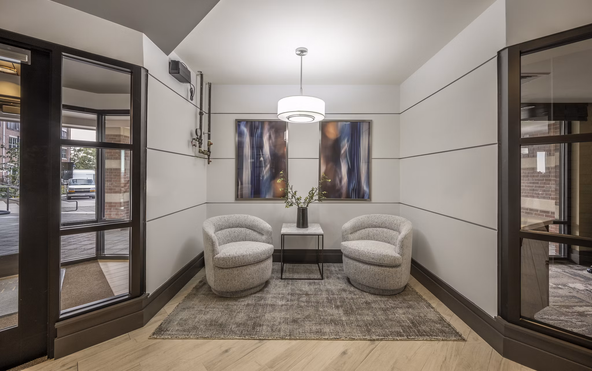 Clubhouse with modern interiors and lounge seating at Arlington 360 Apartments