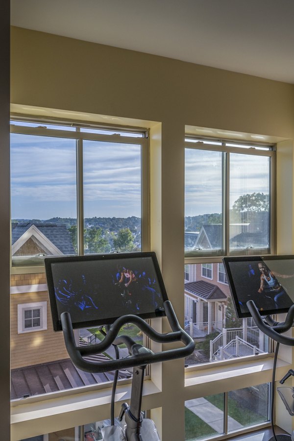 Yoga and spin studio with modern equipment at Arlington 360 Apartments, offering fitness amenities for residents in a luxury setting
