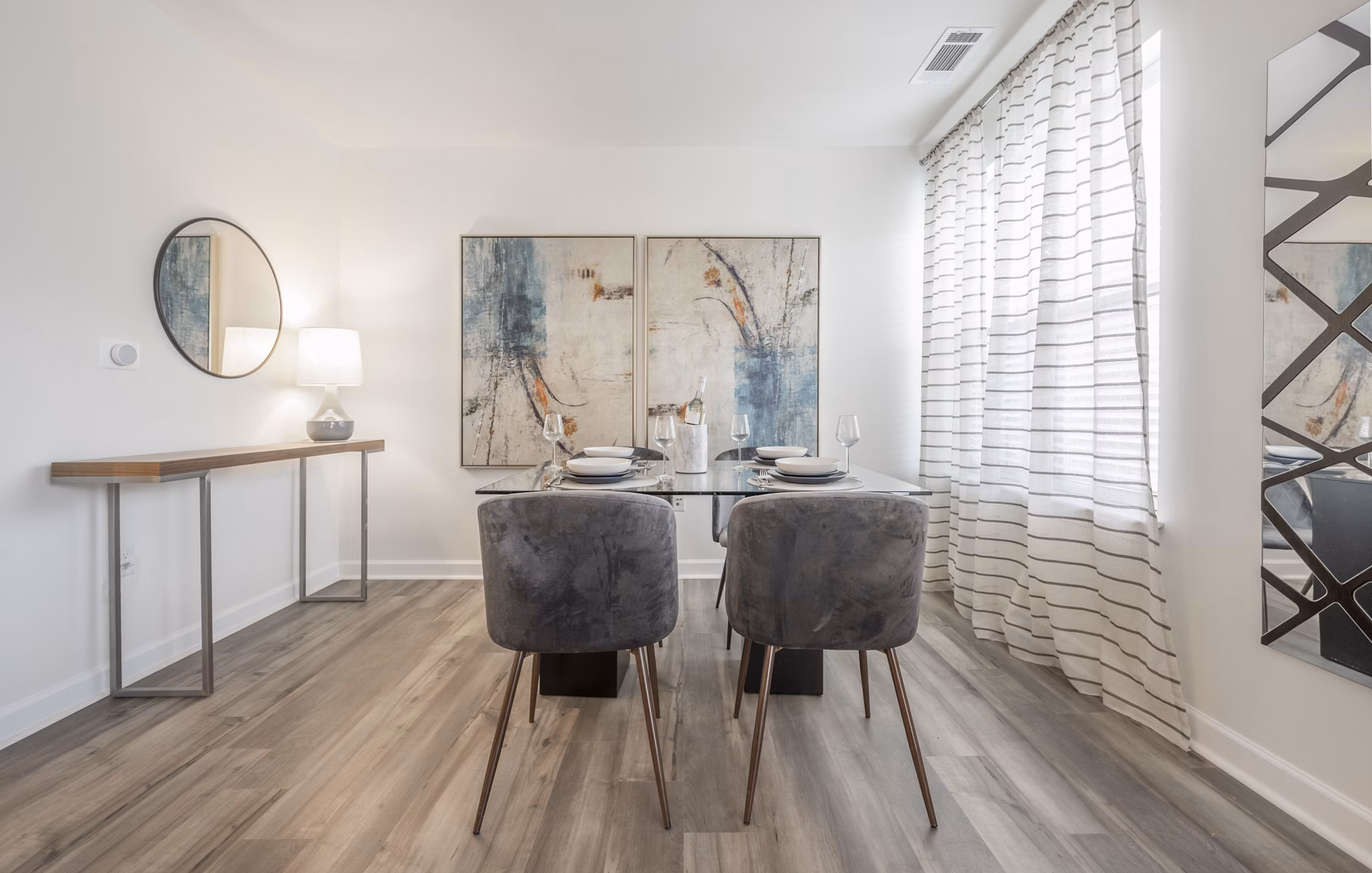 Dine in style at Arlington 360 Apartments: Sleek dining area with modern decor and ample natural light Perfect for entertaining