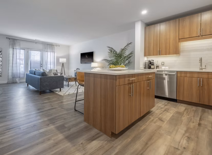 Kitchens with stainless steel appliances at Arlington 360 Apartments in Arlington, offering modern features and spacious design