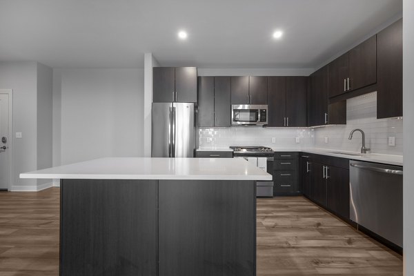 Spacious kitchen with modern appliances at Arlington 360 Apartments