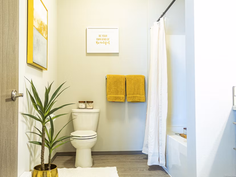Modern tile bathroom with glass shower in Broadway190 Apartments luxury high-rise