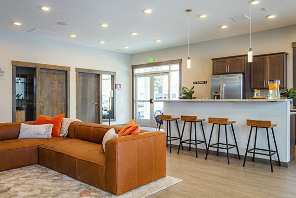 Modern clubhouse at Broadway190 Apartments featuring elegant lounge and communal gathering spaces in a luxurious setting