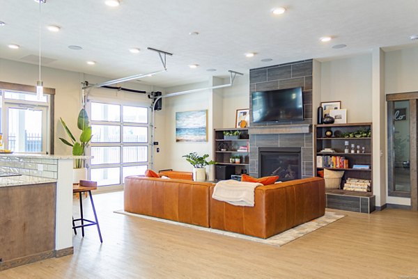 Elegant clubhouse with modern decor at Broadway190 Apartments, perfect for gatherings and relaxation
