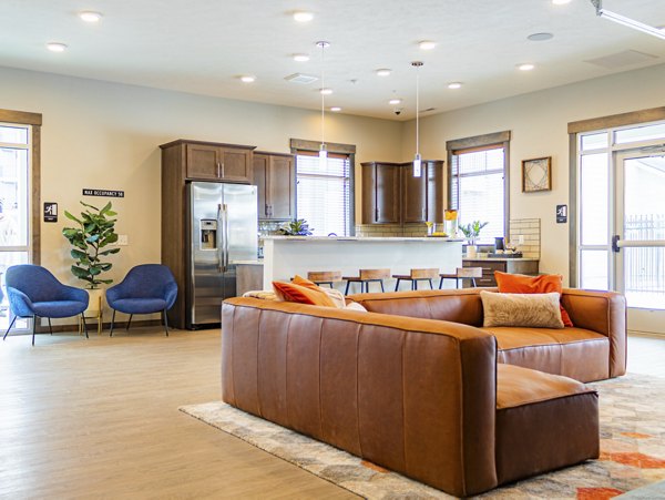 Contemporary clubhouse featuring modern seating areas at Broadway190 Apartments