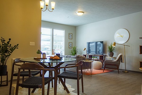 Dining area with modern decor and elegant lighting in Broadway190 Apartments