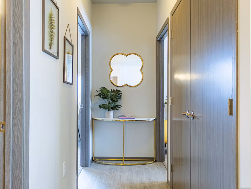 Hallway featuring modern lighting and sleek flooring in Broadway190 Apartments