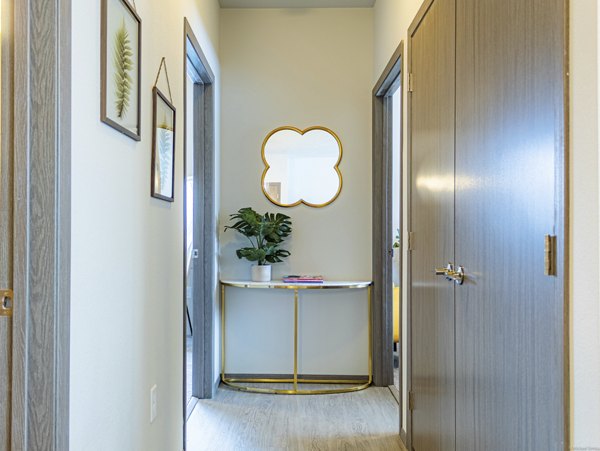 Hallway featuring modern lighting and sleek flooring in Broadway190 Apartments